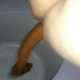 One of our users records his large wife taking a sloppy, wet shit into a plastic bucket while sitting on a porta-potty type chair. Finished product shown in bucket.  